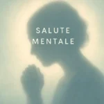Una silhouette di una persona che tiene la testa tra le mani